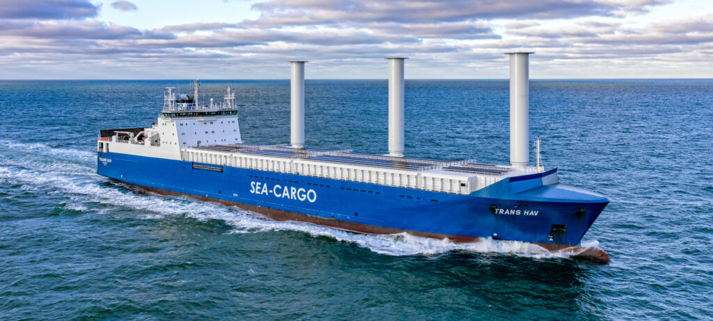 The cargo vessel / RoRo ship Trans Hav retrofitted with rotor sails and solar panels.